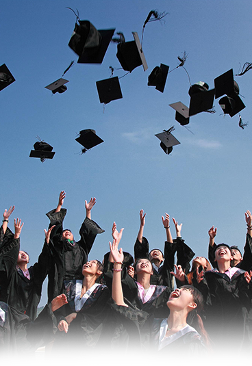 Graduates throwing caps in celebration
